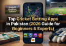 Top Cricket Betting Apps in Pakistan (2026 Guide for Beginners & Experts) A smartphone showing a live cricket betting app betcx7 interface with Pakistani Rupee notes and cricket gear on a wooden desk.